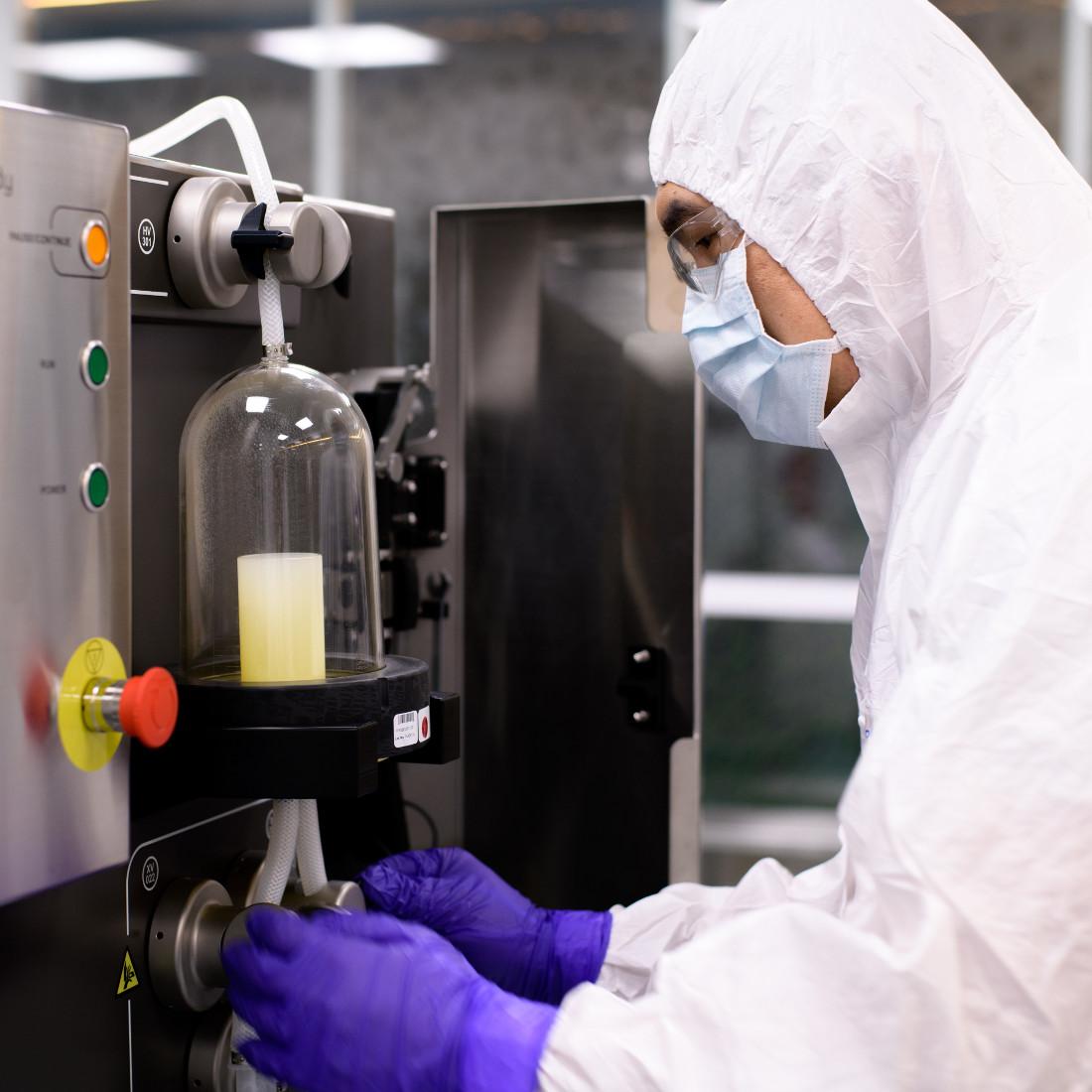 A process engineer operating an ÄKTA Ready Gradient Single Use Chromatography system.