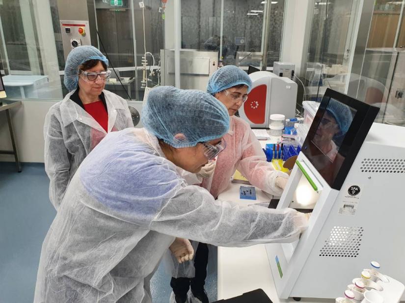 Scientists from NeuClone are trained to handle the LabChip GX II Touch by a scientist from Perkin Elmer in an Analytics Laboratory.