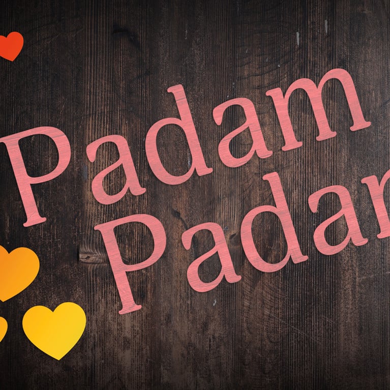 Pink Padam Padam with rainbow hearts on dark wooden board
By Bryony Adobe Stock