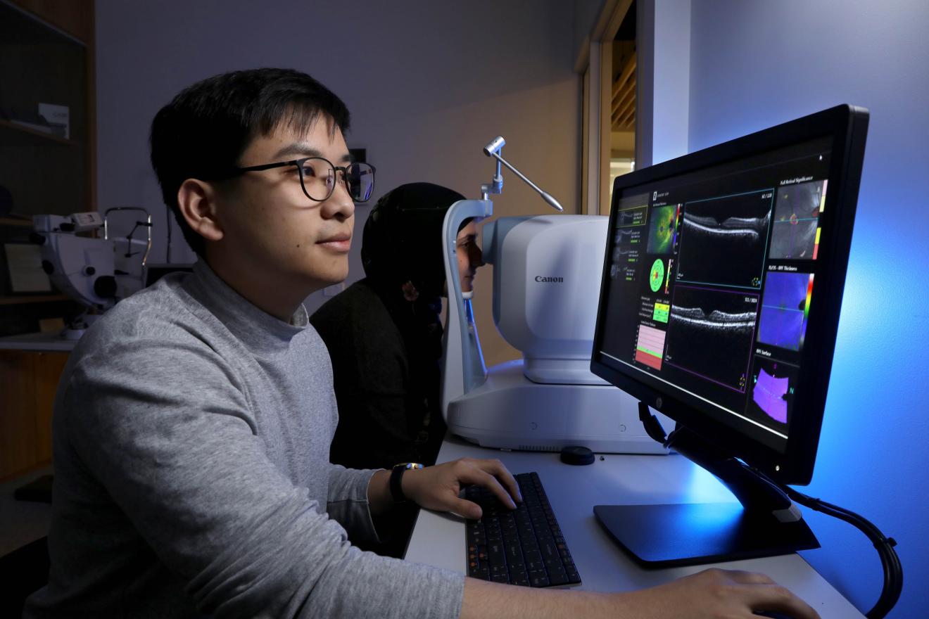 student looks at computer screen