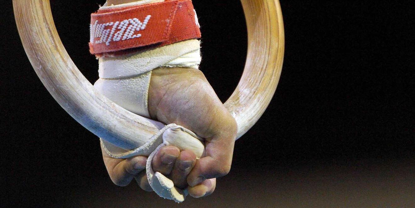 Close up of a hand on a gymnastic ring