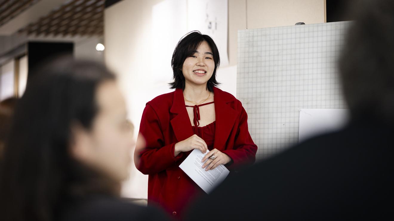 Woman standing in front of a crowd