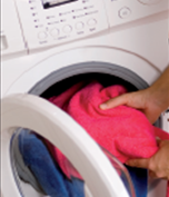 loading clothes in washing machine