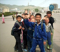 North Korea Kids waving