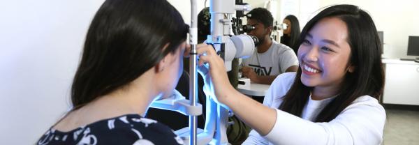 woman doing eye examination