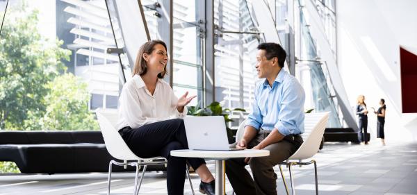 Informal meeting around table with two people