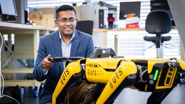 Professor Sarath Kodagoda with the robot dog spot