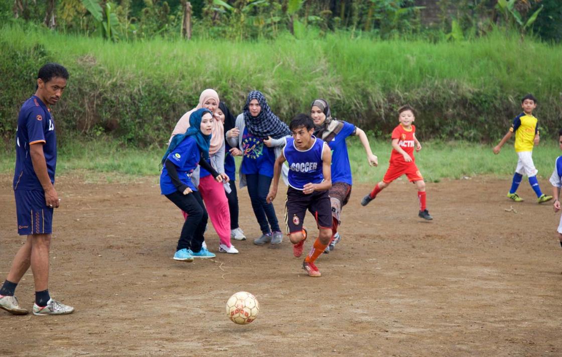 Photo of children playing football