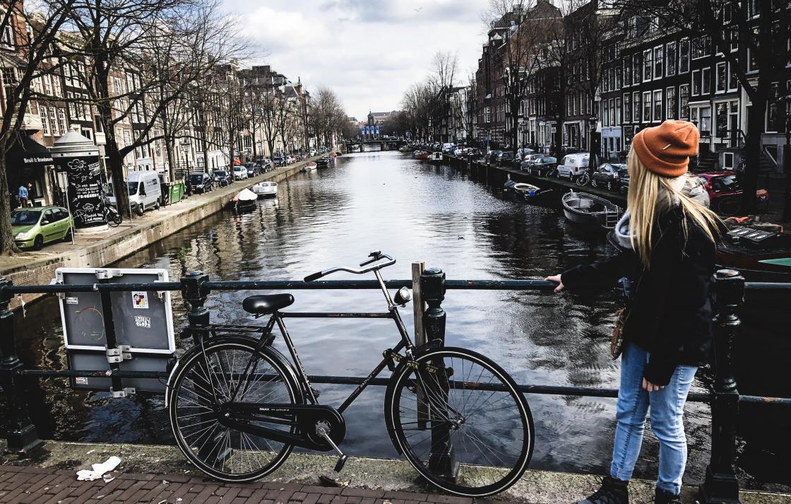 Photo of Kristen next to an Amsterdam canal
