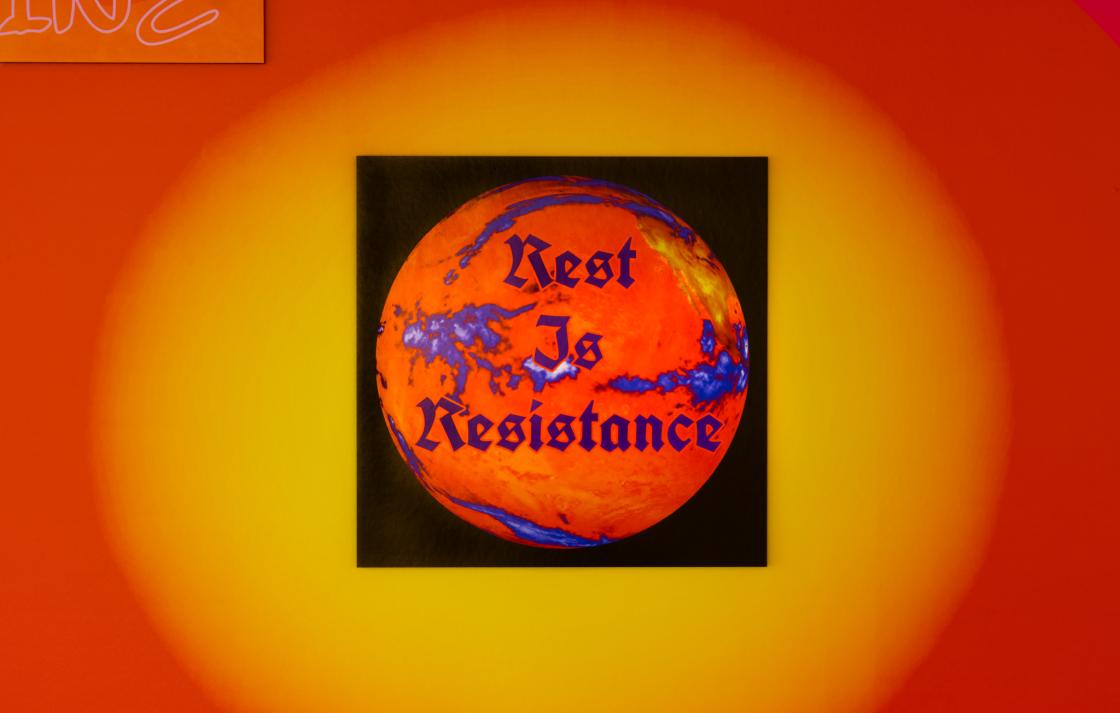 A poster that reads 'Rest is Resistance' 