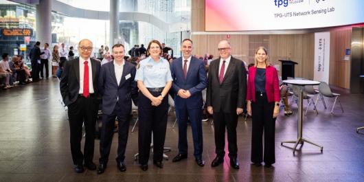 Distinguished Professor Jay Guo, TPG Telecom Chief Technology Officer Giovanni Chiarelli, NSW SES Commissioner Carlene York, Minister for Customer Service and Digital Government Jihad Dib, UTS Vice-Chancellor Professor Andrew Parfitt and Dean of the UTS Faculty of Engineering and Information Technology Peta Wyeth smiling at the camera at the UTS and TPG launch.