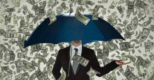 a person stands under an umbrella, cash floating down