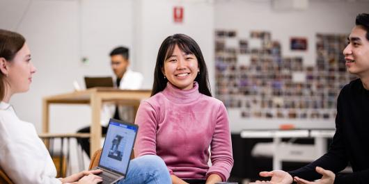 Students smiling and chatting at UTS Startups