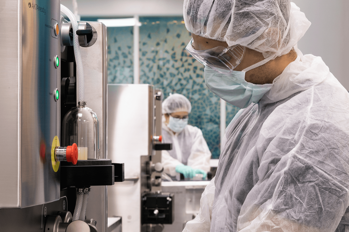 Two researchers working in the Biologics Innovation Facility at UTS