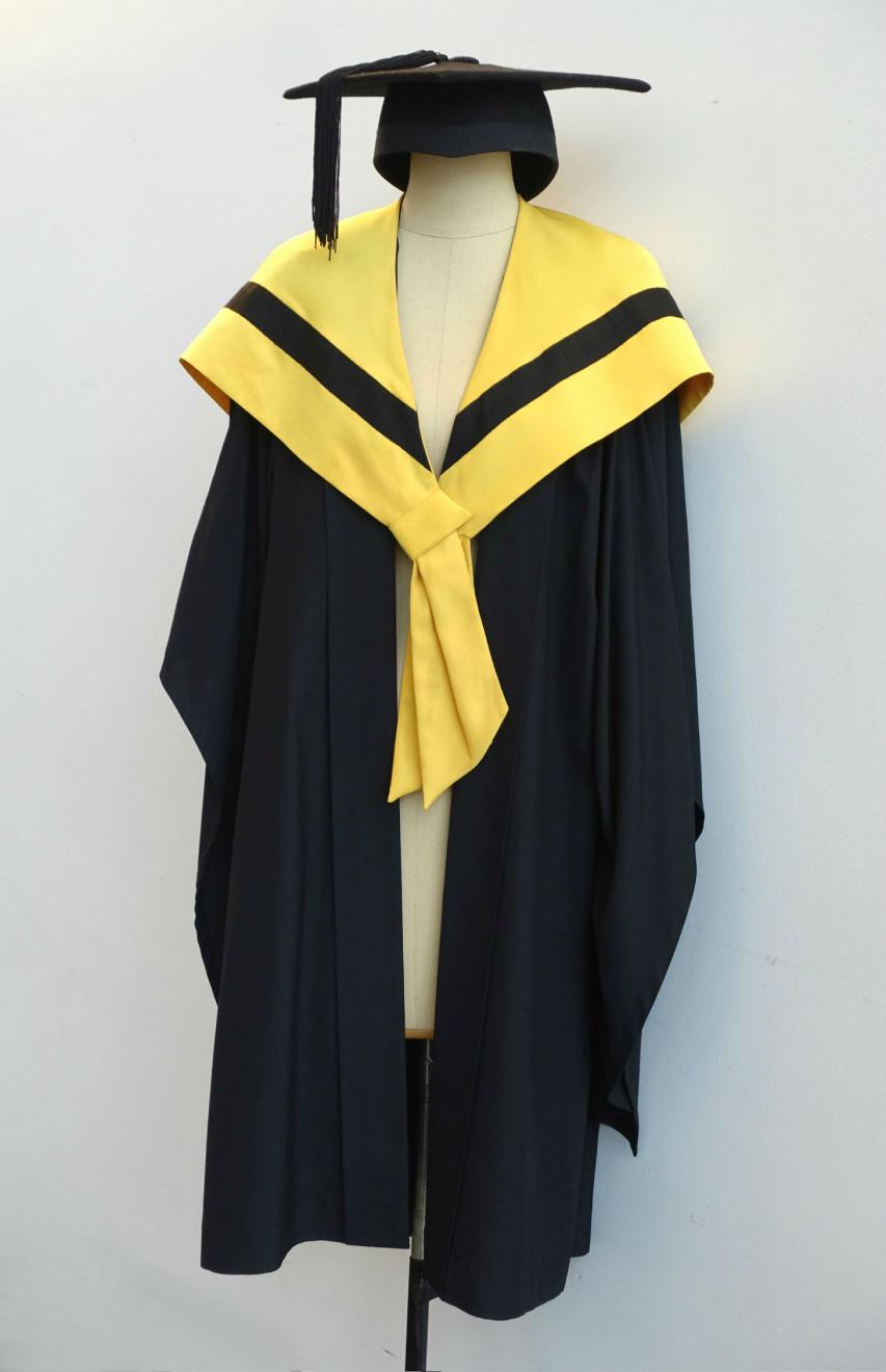 Black Bachelor gown, wattle yellow Bachelor hood for Faculty of Science and a black trencher