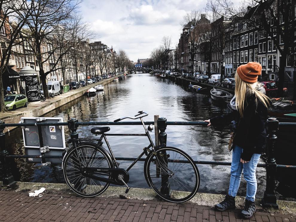 Photo of Kristen next to an Amsterdam canal