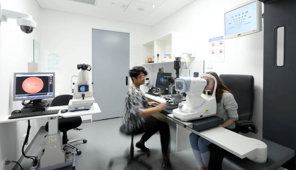 woman taking an eye test