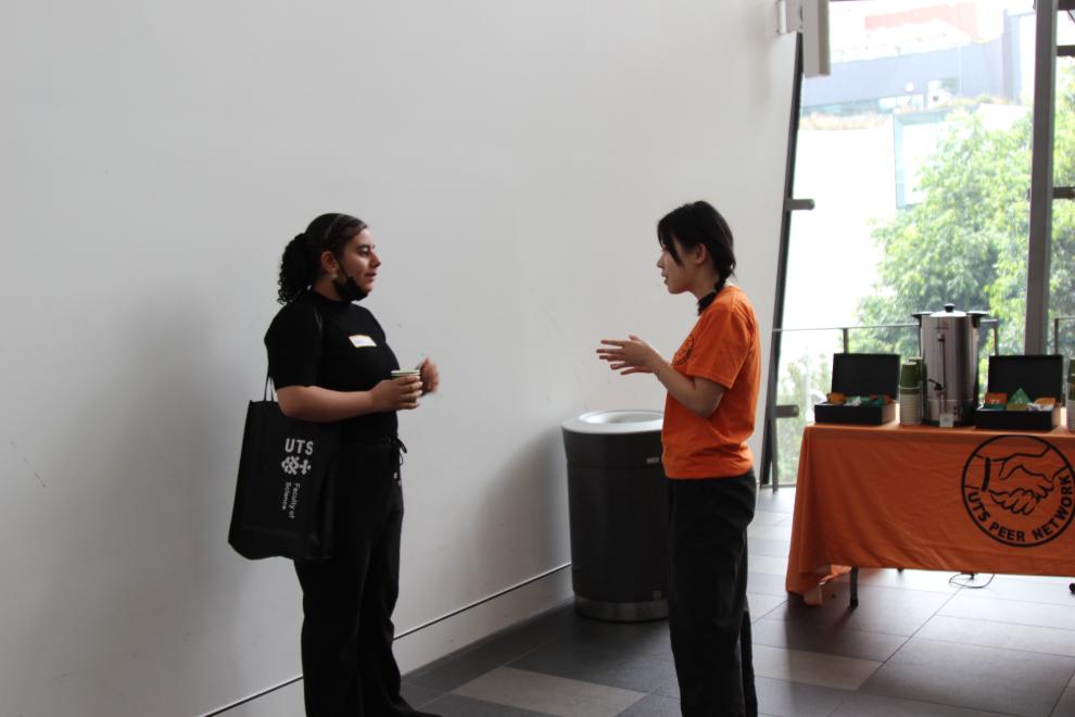 A Peer Networker talking to a student