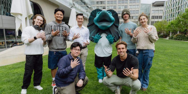 Group of people and Lenny the Lizard at the Polished Man morning tea 2024.