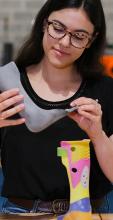 a girl looks at a 3D printed object