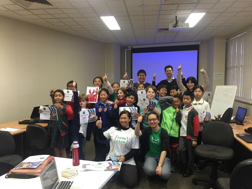 Chau Au posing with a group of students at Code Club at Randwick library