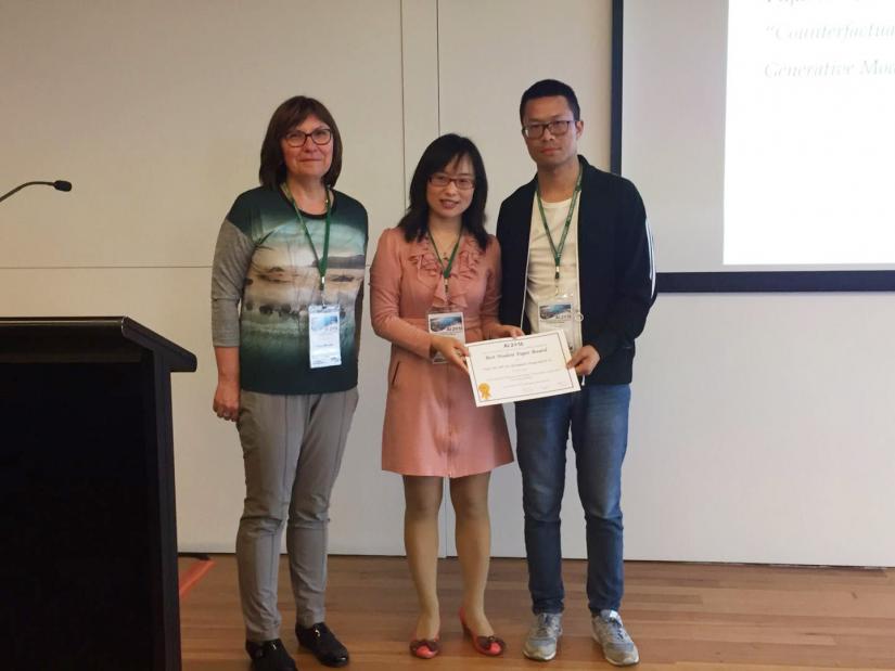 Fujin Zhu (right) with the award presenters Prof Tanja Mitrovic (left) and Dr Bing Xue (middle)