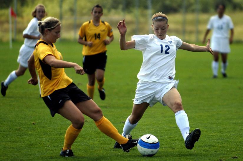 Women playing soccer