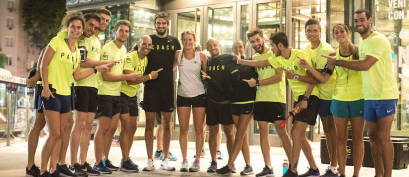 Alana posing with a group of people from a running club