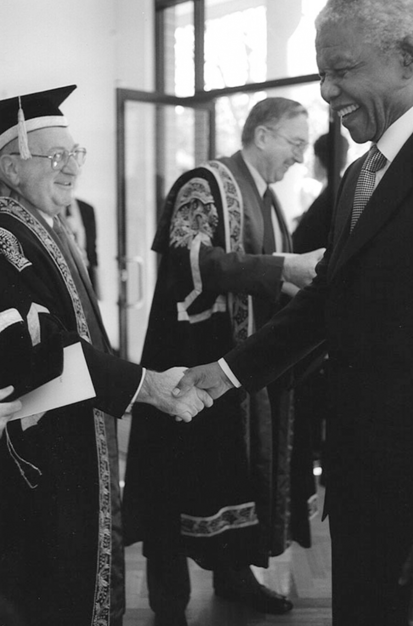 Mandela shaking hands with Vice-Chancellor