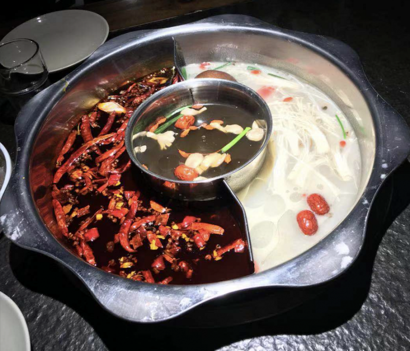 A hotpot with two broths inside