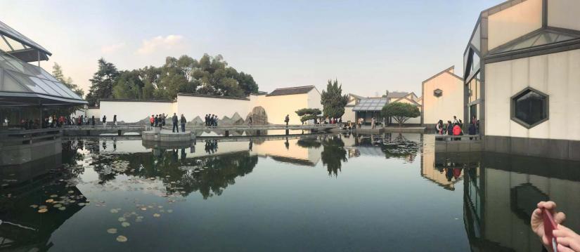 A tourist attraction in China featuring a pond