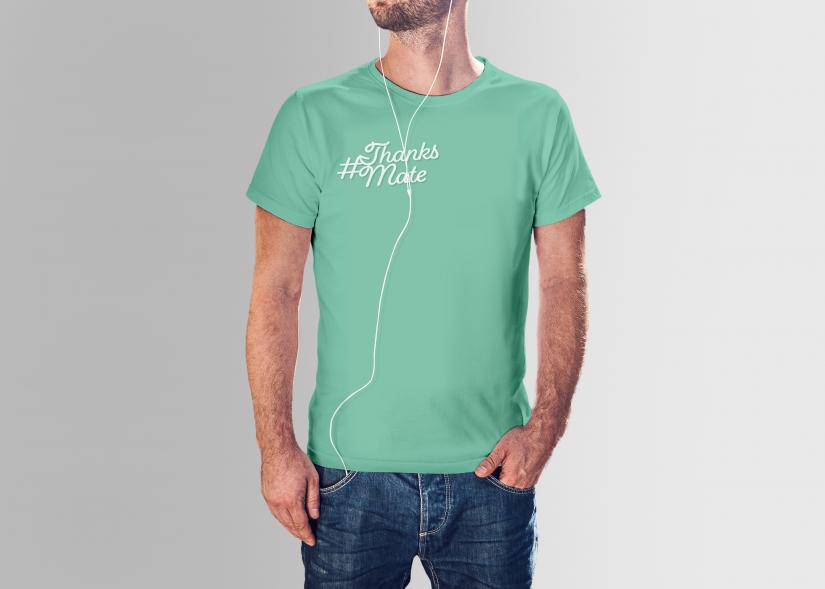 Man wearing a green t-shirt with the thanksmate design mockup