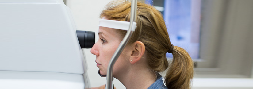 Image of woman undertaking eye test