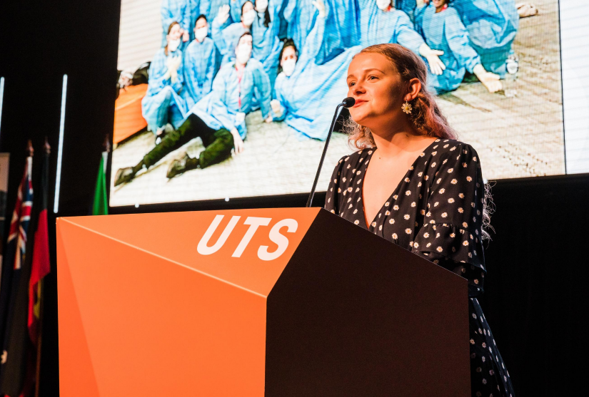 Betty Holland, UTS Midwifery graduate, presenting at the UTS Great Hall lectern