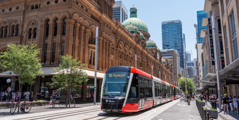 A light rail train carriage approaches in the Sydney CBD