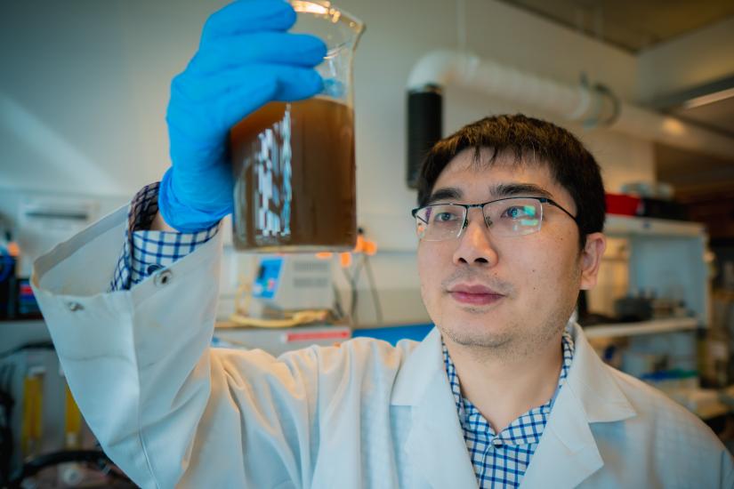 Qilin in a laboratory setting, hold a jar of liquid