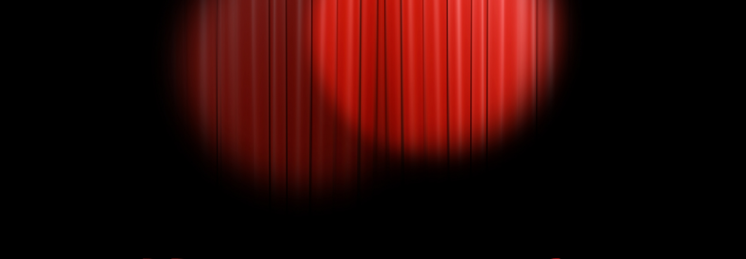 a red stage curtain with spotlights on it