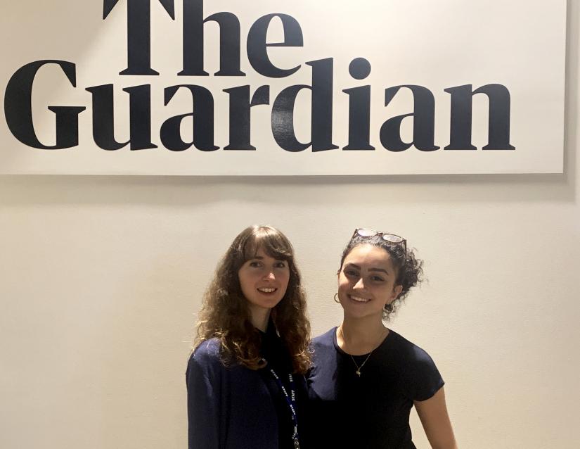 Rafqa Tourma in front of the Guardian signage