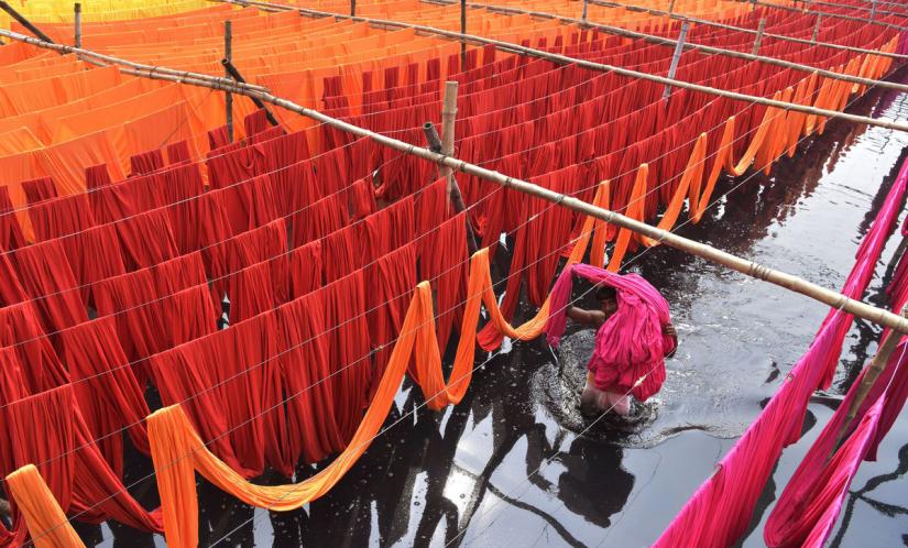 lengths of fabric being dyed red