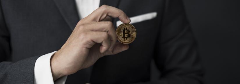 man holding bitcoin