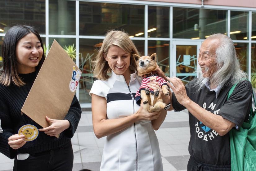 Elyse pictured with Danny Lim when she participated in a campaign to decriminalise swearing, as Lim was arrested for offensive behaviour but ultimately acquitted.