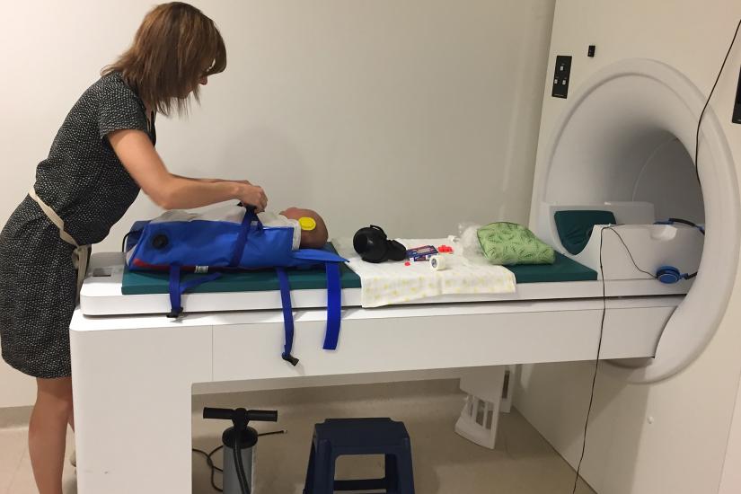 A baby is prepared for the MRI scanner
