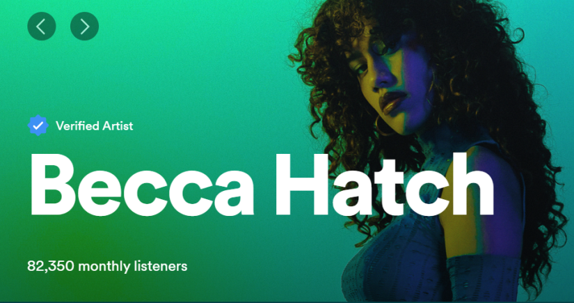 Green Spotify banner image of woman staring at camera. She has long curly hair. 
