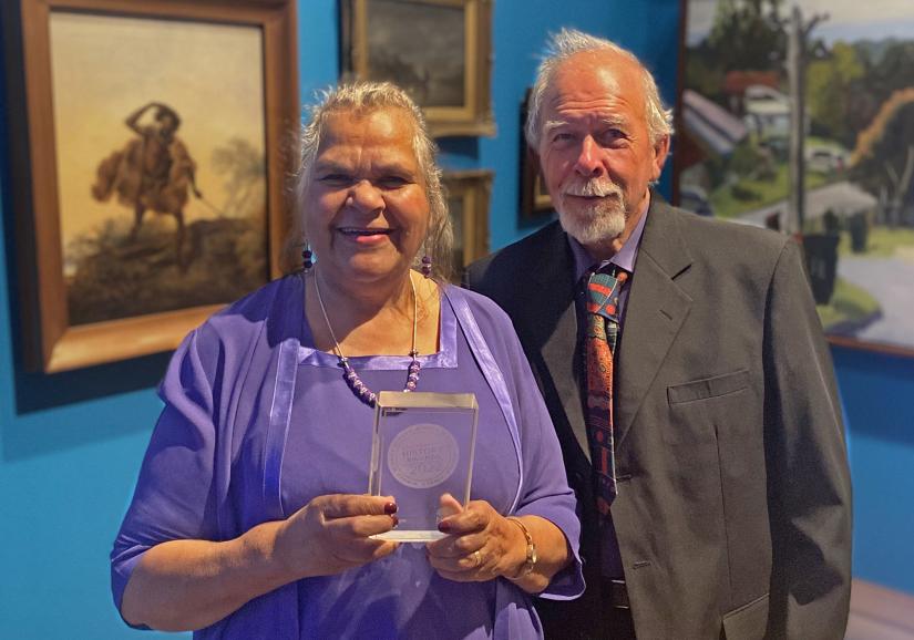 Aunty Loretta Parsley and Trevor Parsley accept the digital history prize