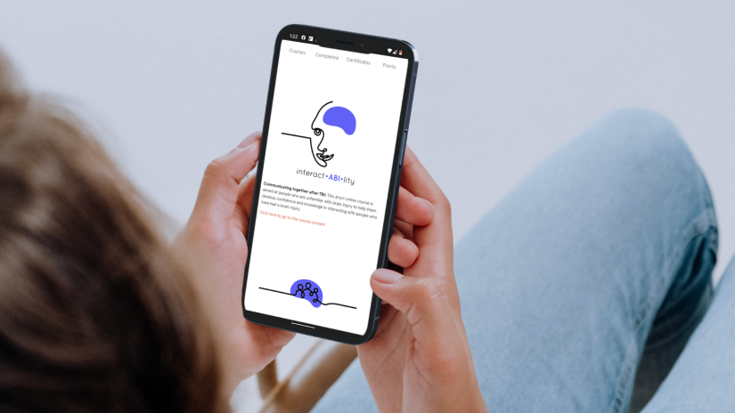 Image of a person using the social brain toolkit on their mobile phone