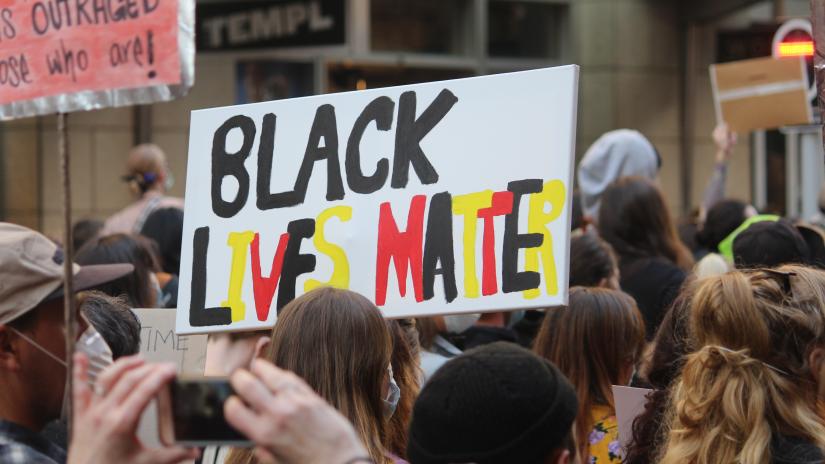 Black Lives Matter sign at protest. Image: Adobe Stock