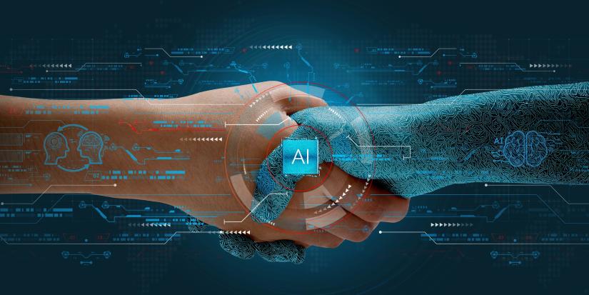 Human shakes hands with AI to show partnership