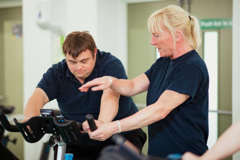 man with down syndrome on exercise bike
