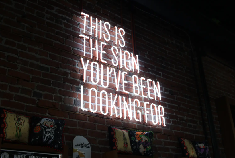 Neon light sign reading: this is the sign you've been looking for