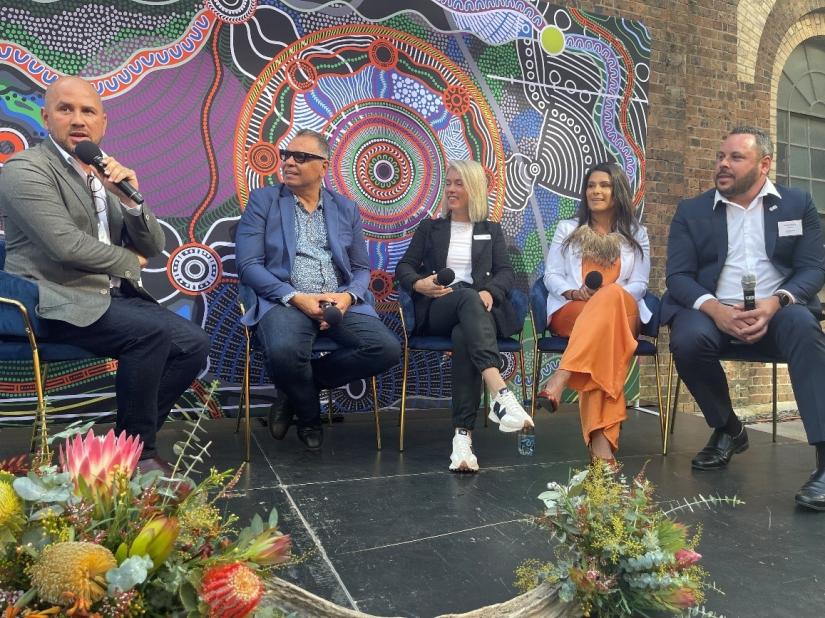 From left to right Adam Bray, Sean Gordon, Alex Holt, Kristal Kinsela and artist David Williams  David's artwork 'A brave heart for a better tomorrow', tells the story of Woolworths Group's reconciliation journey.